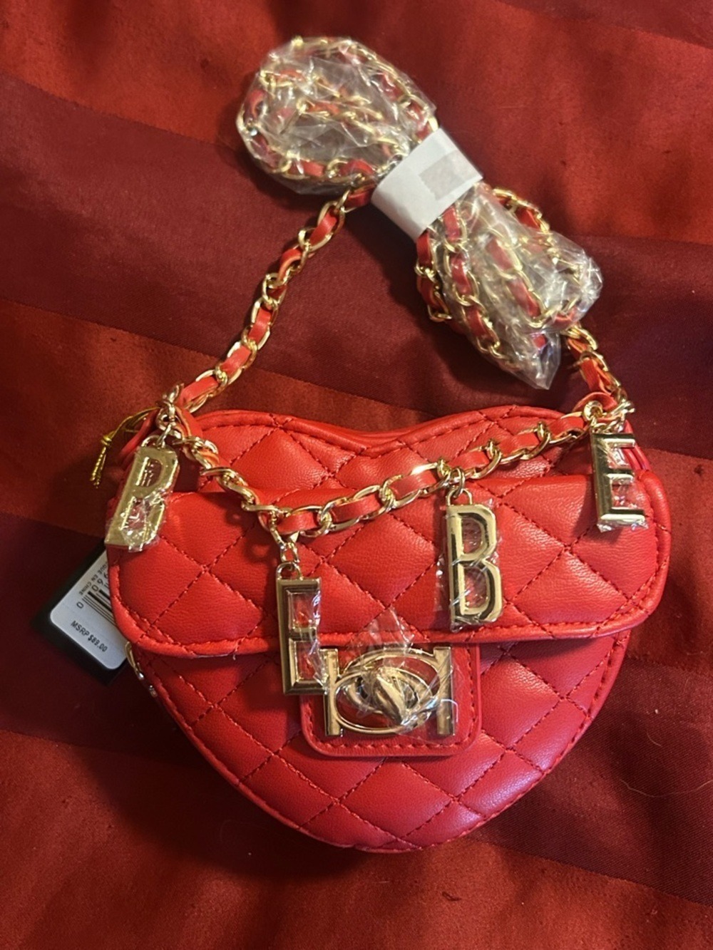 Bebe Red Quilted Heart Crossbody Bag with Gold Chain Charms